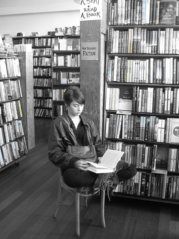 Reader inside bookstore photograph for creator spotlight
