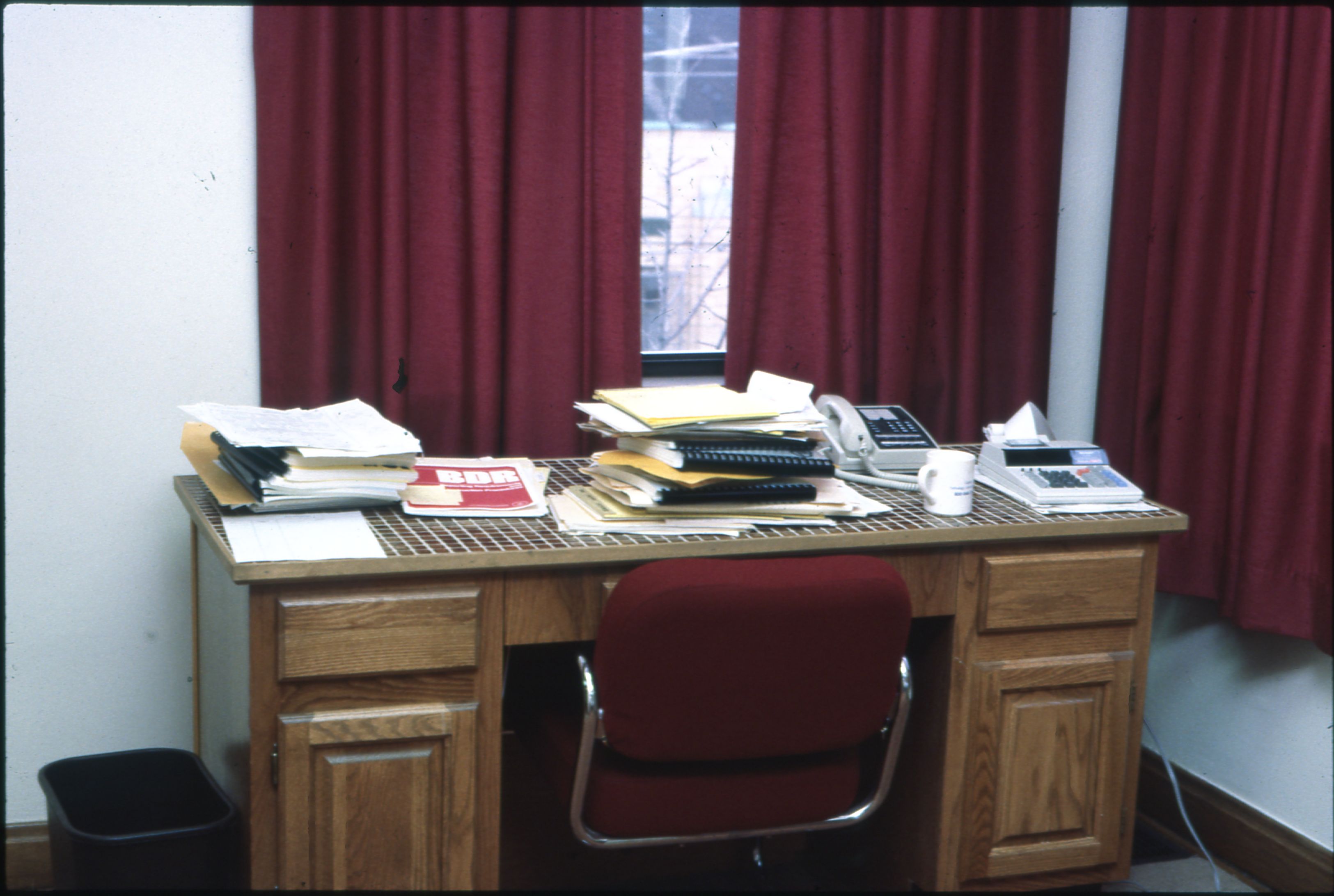Office desk with papers, documents, and publishing workflow materials